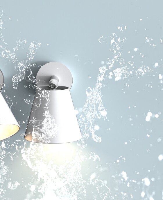 Nástěnné svítidlo Nordlux IP S6 s nastavitelným ramenem vhodné do koupelny, například k osvětlení zrcadla, v bílém provedení.