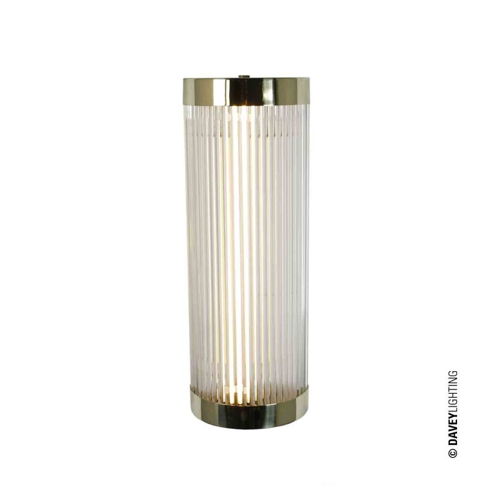 Nástěnná lampička Pillar Wide od Original BTC. Čiré skleněné trubice. Základna a vršek kov. Art Deco styl, vhodná do koupelny. (leštěná mosaz)