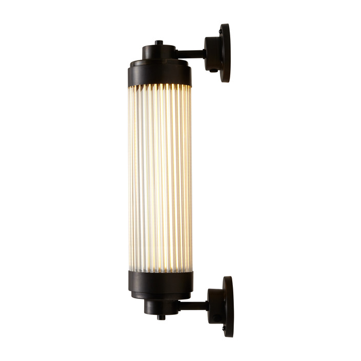 Nástěnná lampička Pillar Offset LED od Original BTC. Čiré skleněné trubice. Základna a vršek kov. Se stmívačem. Art Deco styl, vhodná do koupelny  (mosaz s patinou)