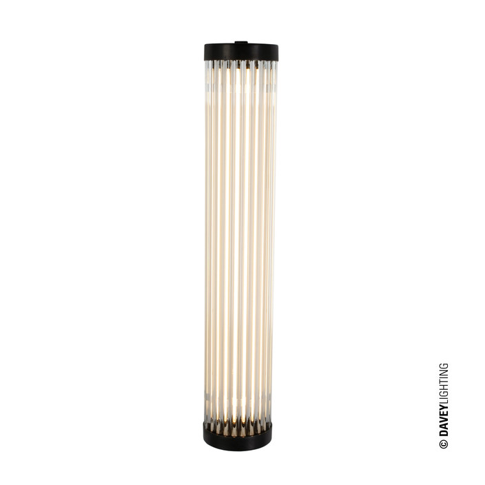 Extra úzká nástěnná lampička Pillar LED Extra Narrow 40 od Original BTC. Čiré skleněné trubice. Základna a vršek kov. Art Deco styl, vhodná do koupelny  (mosaz s patinou)